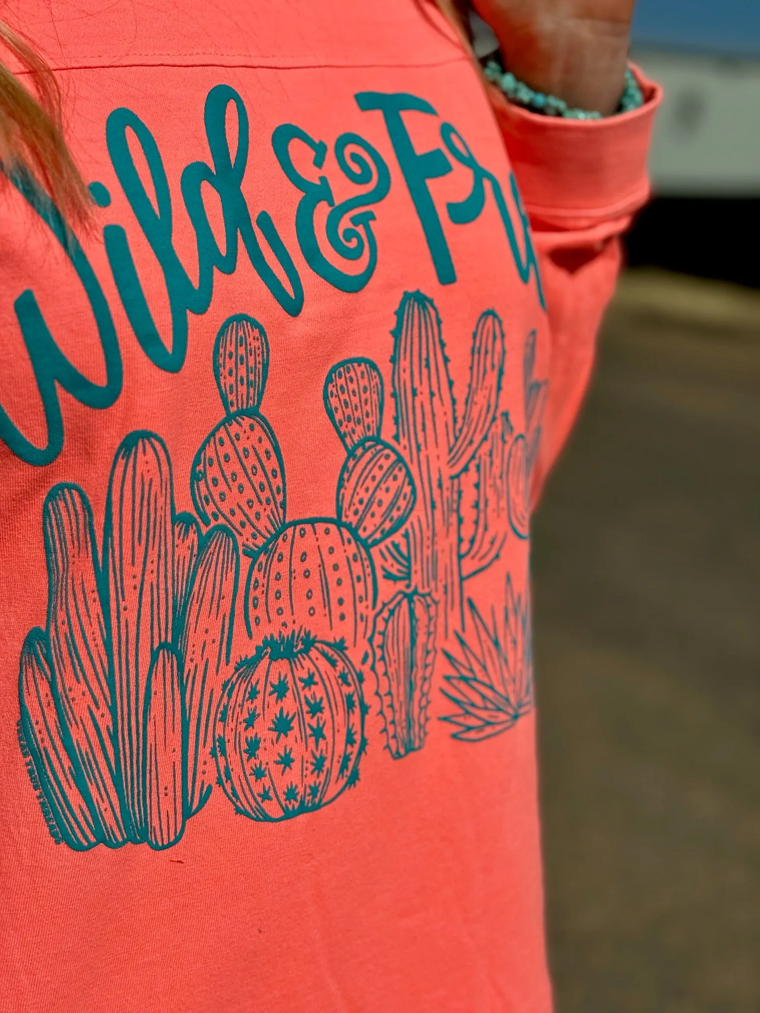 Wild & Free Turquoise Puff Ink on Coral Long Sleeve